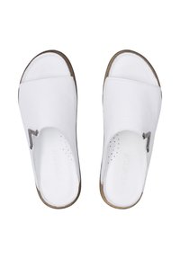 Witte leren instapsandalen met een open teen en een gebogen banddetail. Heeft een geperforeerde inlegzool en een bruine rand aan de zool.