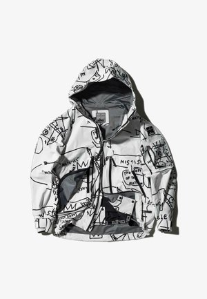 Valge jakk mustade graafiliste mustritega. Omab kapuutsi, tõmblukuga taskuid ning on valmistatud kergest veekindlast materjalist.