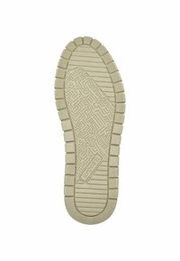 Beige gumová podrážka se strukturovaným vzorem s designem bludiště, s vroubkovanými okraji a výraznými trny pro lepší grip.