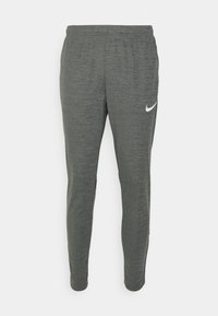 Pantalones deportivos grises con una textura jaspeada. Presentan un logo de Nike blanco en la cadera izquierda. Cintura elástica y corte ajustado.