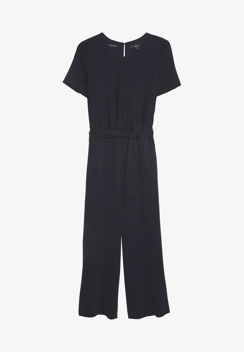 Combinaison noire à manches courtes avec jambes larges et ceinture en tissu nouée à la taille, dotée d’un col rond et d’une fermeture éclair dans le dos.