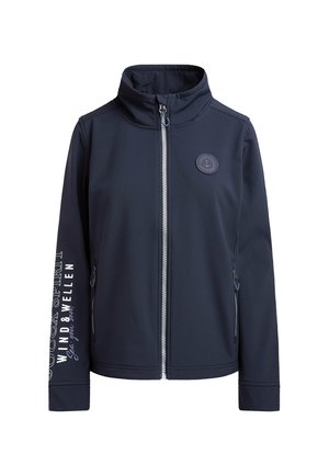 Navy softshell jacket with a high collar, front zip closure, and two side pockets. Features logo patch and white text on the sleeve.