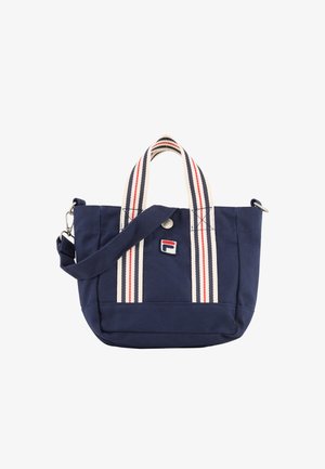 Marineblå shopper med cremefarvede håndtag med røde og marineblå striber, en aftagelig skulderrem og et lille broderet brandlogo.