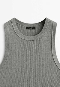 Grey ribbed knit sleeveless top with round neckline and a black brand label at the back collar.