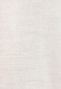 Tessuto elasticizzato color beige chiaro con una finitura fine e uniforme e piccole, sottili variazioni di colore. Ideale per abbigliamento o arredamenti morbidi.