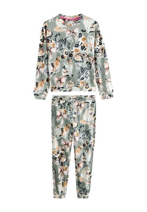 Harmonizáló pulóver és melegítőnadrág szett, színes macska illusztrációkkal és rózsaszín masnikkal tompított zöld háttéren.