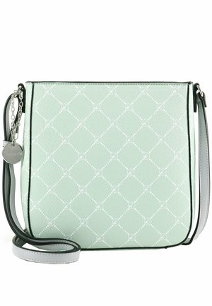 Sac bandoulière vert clair avec motif losanges blancs, bordure noire, sangle réglable et breloque ronde argentée suspendue à une chaîne.