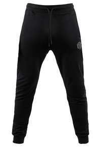 Pantaloni da jogging neri realizzati in materiale morbido, con vita regolabile con cordoncino, vestibilità slim e tasche laterali. Piccolo logo sulla coscia sinistra.