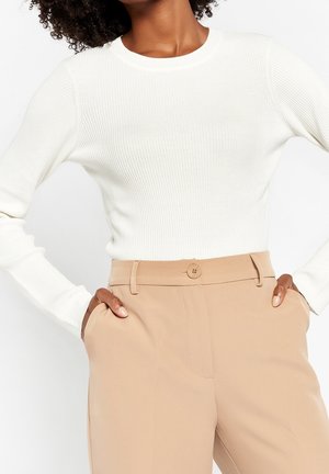 Stickad tröja - beige