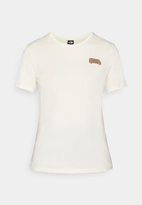 T-shirt a maniche corte color crema in cotone con una piccola grafica marrone di un furgone nell'area sinistra del petto. Design con scollatura tonda.