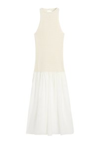 Sleeveless beige knit top dress with a high neckline and flowy white gathered skirt extending below the knees.
