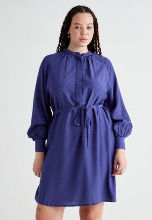 Purple dress with a high neckline, balloon sleeves, and an adjustable waist tie. Faint vertical stripes and smooth texture.