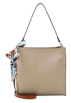 Beige square leather handbag with black and brown straps, decorated with a tied multicolor patterned silk scarf on the handle.