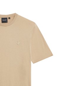 T-shirt in cotone beige con maniche corte e scollatura a girocollo, caratterizzato da un piccolo logo ricamato in alto a sinistra. Texture liscia.