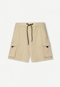 Pantaloni scurți cargo bej cu talie elastică și șnur negru. Oferă două buzunare cargo laterale și un față plată. Textură de țesătură netedă.