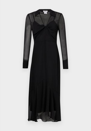 Abito nero a maniche lunghe con corsetto aderente, dettaglio annodato sul davanti e orlo svasato. Realizzato in tessuto leggero e trasparente.