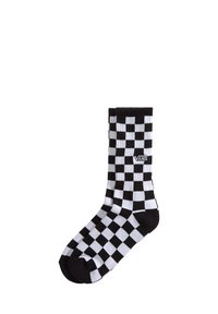 Calzino in cotone a trama a scacchi bianco e nero con parte superiore a coste. Presenta il logo Vans sul lato. Materiale leggero e traspirante. Altezza standard da crew.
