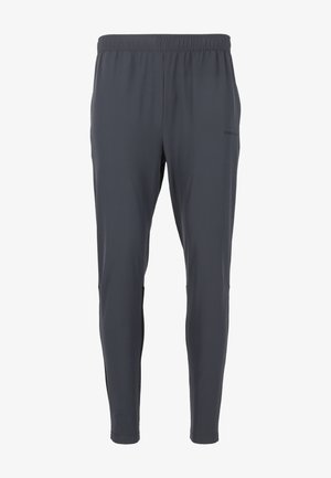 Mørkegrå træningsbukser med elastisk talje, tætsiddende design og sidelommer. Fremstillet af letvægts, åndbart stof.