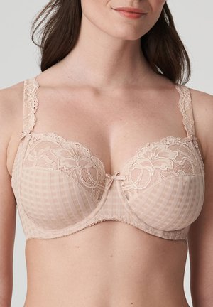 Beige bra with checked fabric and lace overlay. Features bow detail at the center and scalloped lace straps. Underwire support included.
