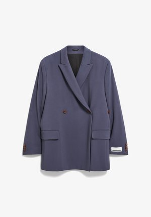 Dubbelzijdige blazer in donkergrijze stof. Opvallende kenmerken zijn de bruine knoopaccenten, twee voorzakken met klep en een zwarte voering.