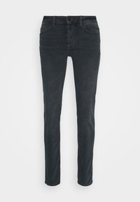 Tmavě šedé slim-fit džíny s předními kapsami a poutky na opasek, vystavené na bílém pozadí.