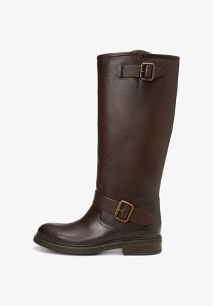 Tall dark brown leather boot with two adjustable brass buckles, rounded toe, low stacked heel, and textured rubber sole.