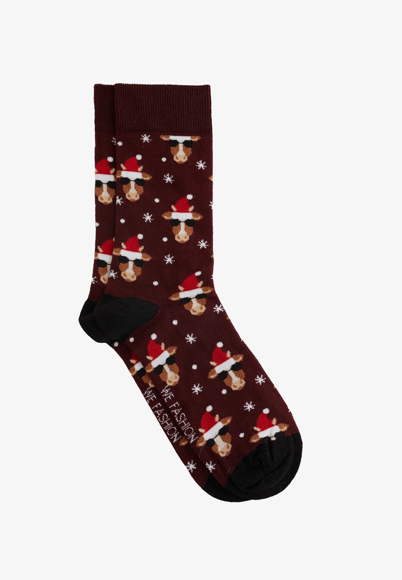 Brūni zeķes ar atkārtotu karikatūru govju rakstu, kas nēsā Ziemassvētku cepures un saulesbrilles, ar baltām sniegpārsliņām izkaisītām visā virsmā. Melni pirksti un maliņas.