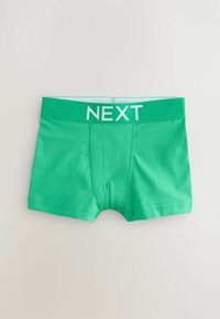 Grön bomullsbadbyxa med en mjuk textur, som har ett brett grönt midjeband märkt "NEXT" i vitt, med en åtsittande form och platta sömmar.