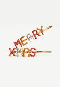 Zlaté sponky na vlasy mají text "MERRY XMAS" vyložený červenými, stříbrnými a jantarovými rhinestony, s texturovaným kovovým základem.