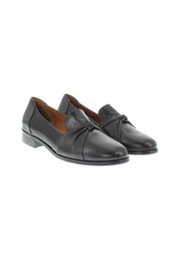 Mocassins en cuir noir avec un détail noué à l'avant, talon plat et texture lisse. Design classique adapté à diverses occasions.