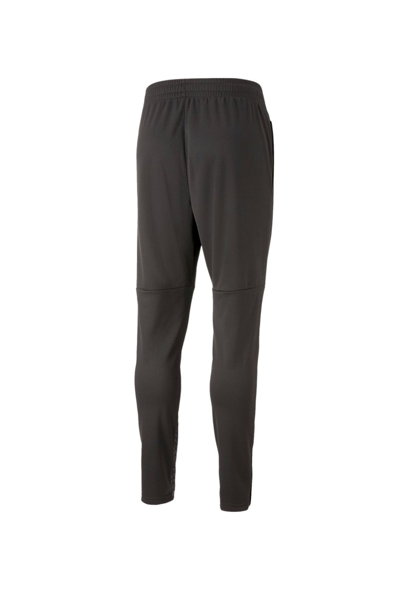 Pantaloni sportivi neri con tessuto testurizzato, gamba affusolata, vita elastica e dettagli di cucitura visibili.