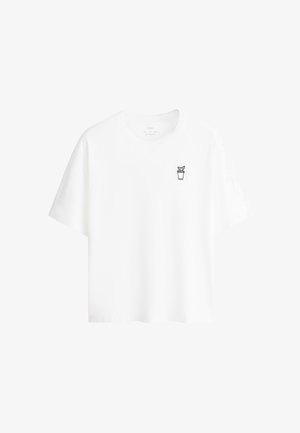 T-shirt blanc à manches courtes avec un petit dessin au trait noir d'une plante en pot sur la poitrine gauche.