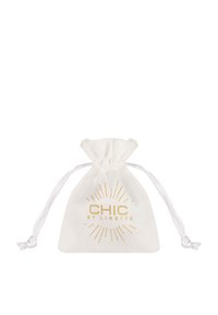 White fabric pouch with a drawstring closure, featuring gold print of "CHIC BY LIRETTE" and sunburst design. Smooth texture.