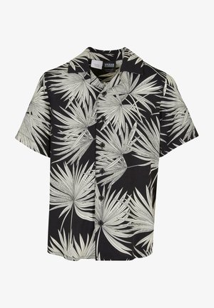 Camisa de manga corta con fondo negro y patrones de hojas de palma blancas, cierre frontal con botones y diseño de cuello clásico.