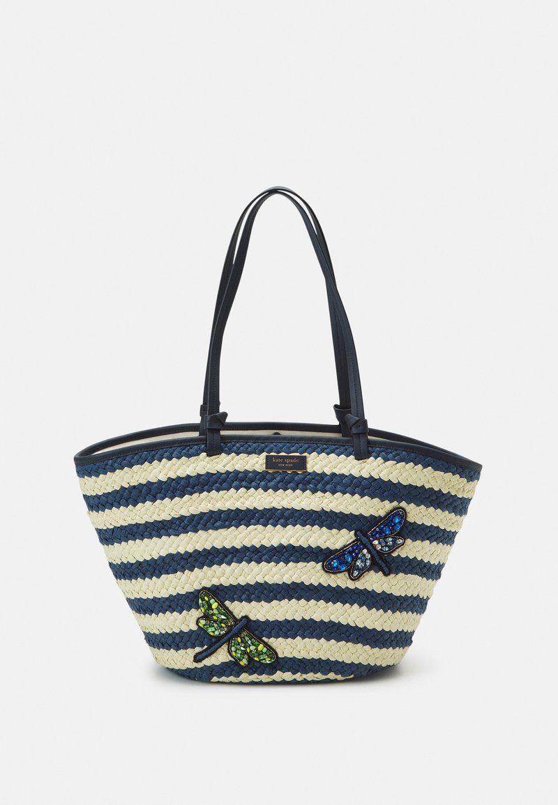 Striped straw tote bag in navy and cream, featuring textured butterfly appliqués in green and blue, with black leather handles.