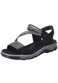 Sandale noire avec des brides grises tissées, semelle intérieure noire rembourrée, semelle texturée noire et détail de couleur accentuée sur la semelle extérieure.