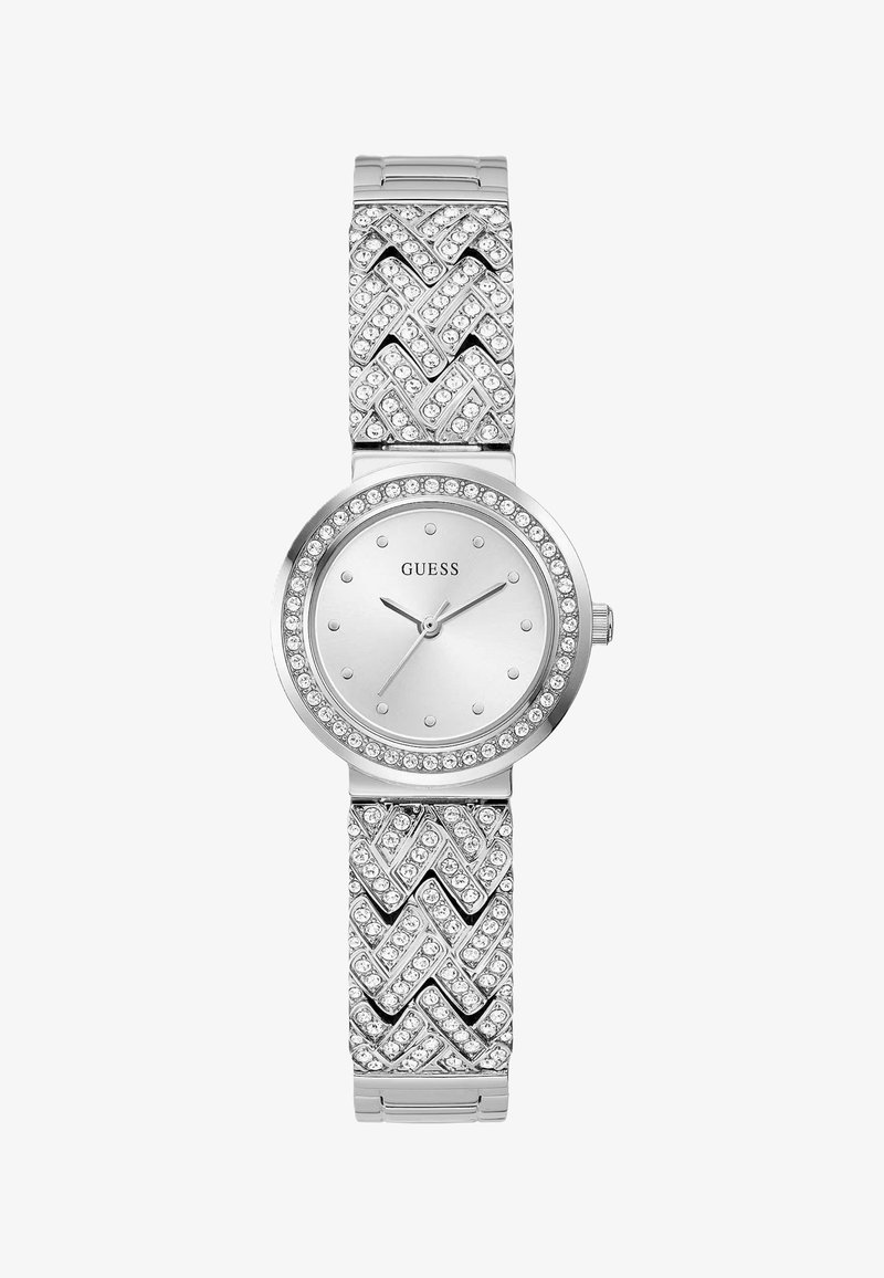 Sølvur med rund urskive, tekstureret rem med zigzag-mønstre og indlagte krystaller rundt om bezel og armbånd.