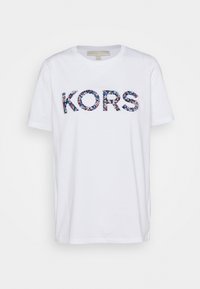 Bílá bavlněná tričko s nápisem "KORS" v květinovém vzoru, kulatým výstřihem a krátkými rukávy. Jednoduchý design, měkká textura a standardní střih.