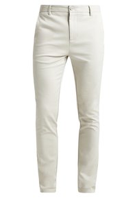 Pantaloni slim-fit beige chiaro realizzati in tessuto morbido, con chiusura a pulsante, tasche laterali e un design pulito senza motivi visibili.