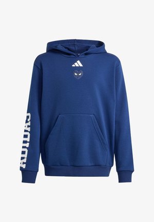 Sininen Adidas-huppari etutaskulla, valkoinen Adidas-logo sydämen yläpuolella, jossa on silmät rinnassa, ja valkoinen "Adidas"-painatus vasemmassa hiha.