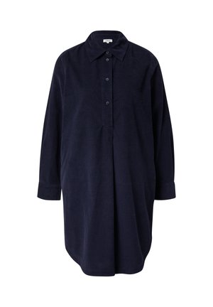Navyblauw corduroy shirt jurk met een knoopsluiting, kraag en lange mouwen. Beschikt over een losse pasvorm en subtiele plooien aan de voorkant.