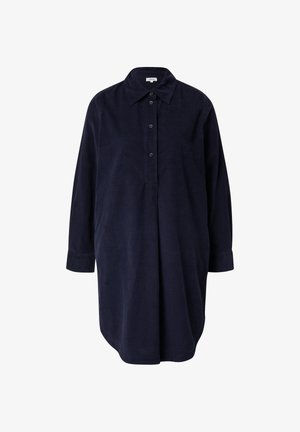 Tume sinine korjeerkangast särgimekko, millel on nööpide rida, krae ja pikad varrukad. Omab vabalt langevat lõiget ja peeneid voldikesi ees.