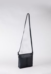 Black leather crossbody bag with a braided detail on the front, featuring a long adjustable strap and a zip closure. Smooth texture.
