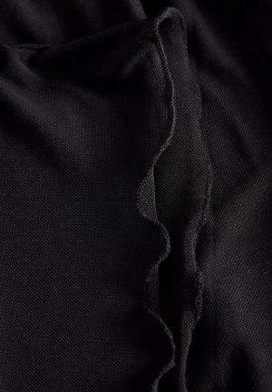 Black fabric with a textured, wavy edge detail. The material appears lightweight and slightly gathered, showcasing a smooth surface.