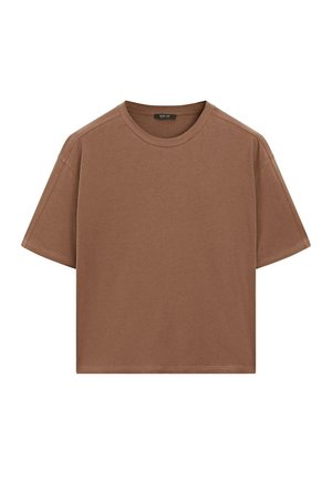 Brązowy t-shirt z krótkim rękawem wykonany z bawełny. Posiada okrągły dekolt oraz luźny krój, z widocznymi szwami wzdłuż rękawów i dołu.