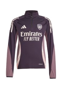 Haut de sport à manches longues violet avec un zip semi-ouvert, logos de sponsors blancs et panneaux latéraux avec un motif géométrique violet plus clair.