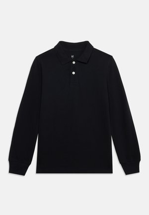 Polo noir à manches longues avec deux boutons blancs et un col classique, présenté sur un fond clair uni.