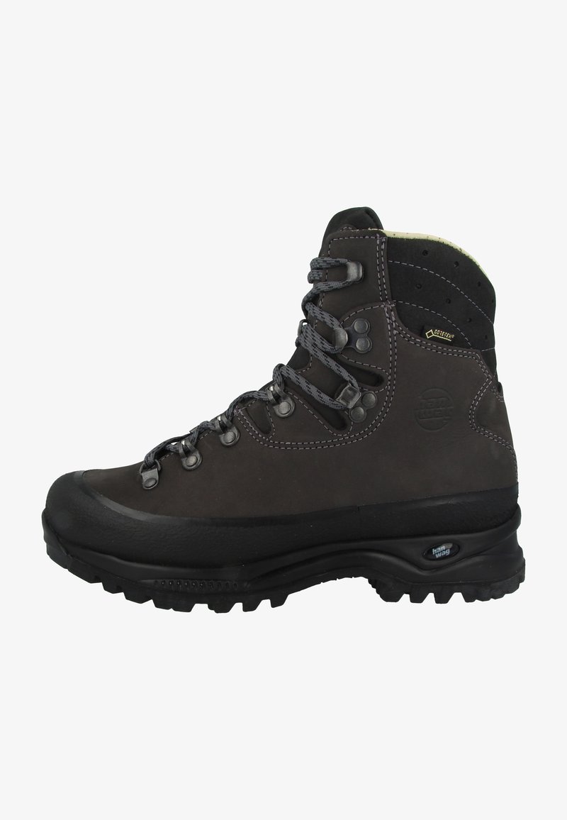Bota de caminhada em couro castanho com cano alto, ilhós de metal, biqueira de borracha e sola texturizada, apresentando a marca Gore-Tex na lateral.