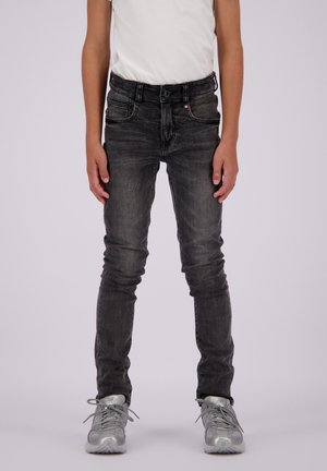 Mørkegrå jeans laget av denim, slim fit, med fem lommer og glidelås. Har subtile sømdetaljer og en liten farget logo på midjebåndet.