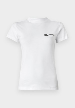 Valge puuvillane T-särk ümarate kaelustega. Lühikesed varrukad ja must logo tekst "KARL LAGERFELD JEANS" vasakul rinnal.